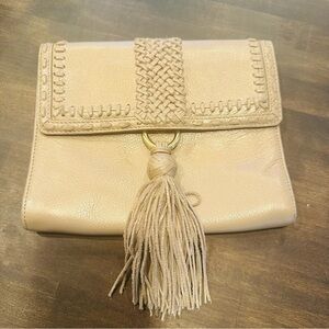 Alexis Hudson tassel clutch